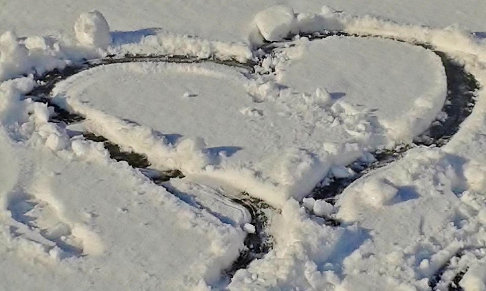 snow filled heart shape background