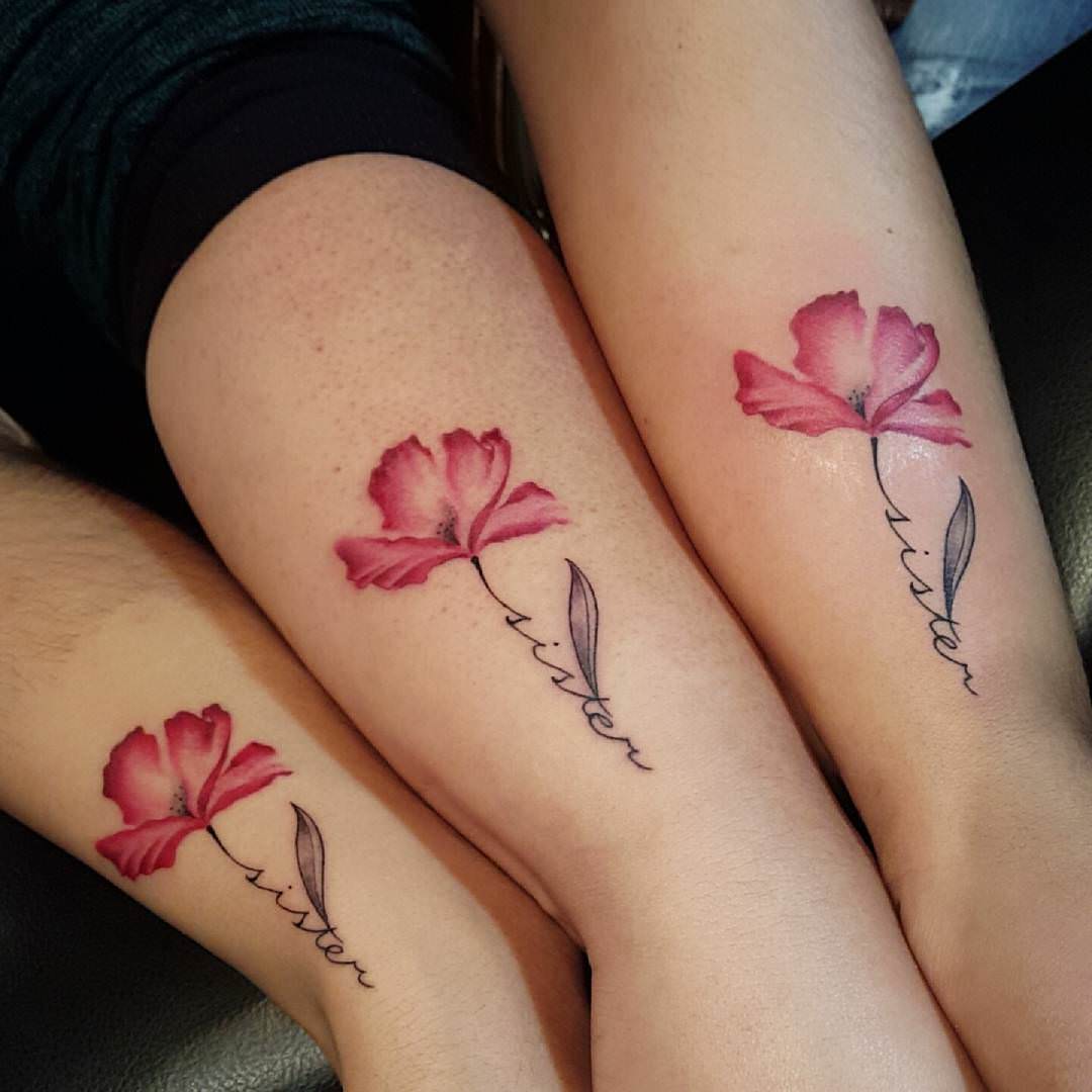 attractive pink flower tattoo