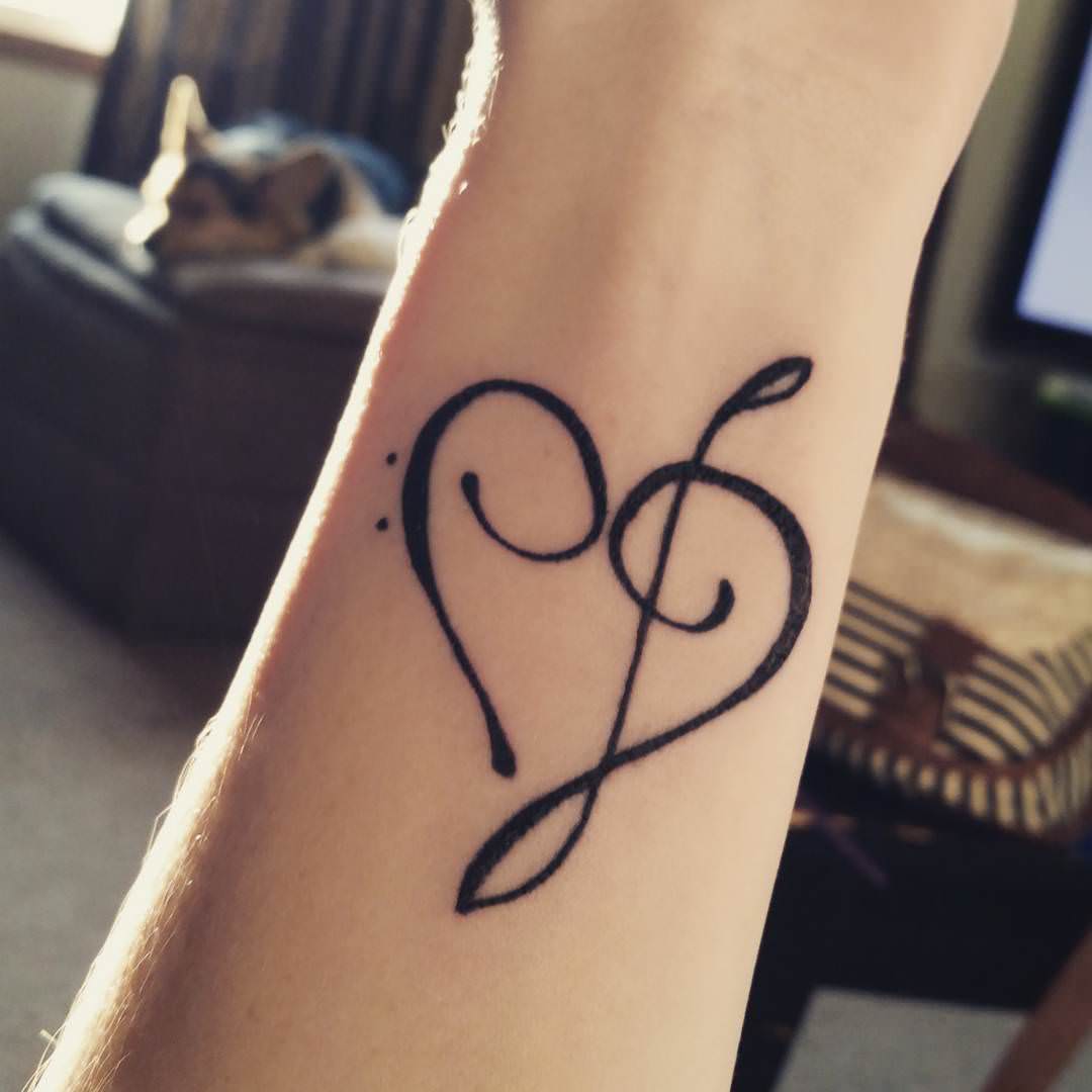 attractive music heart tattoo design