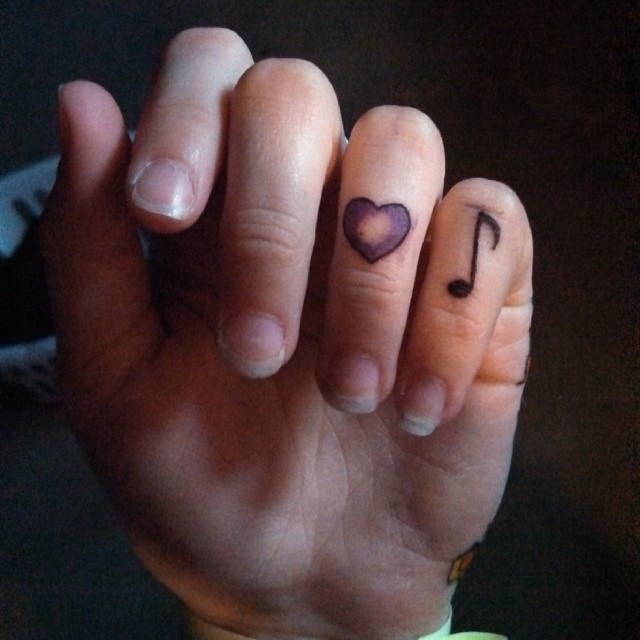 tiny cute tattoo design on fingers