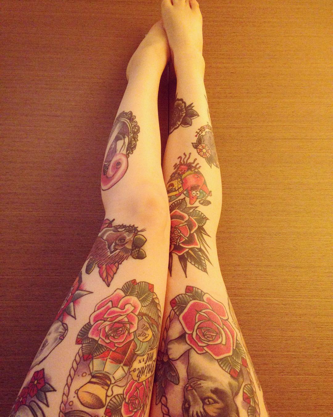 beautiful pink leg sleeve tattoo