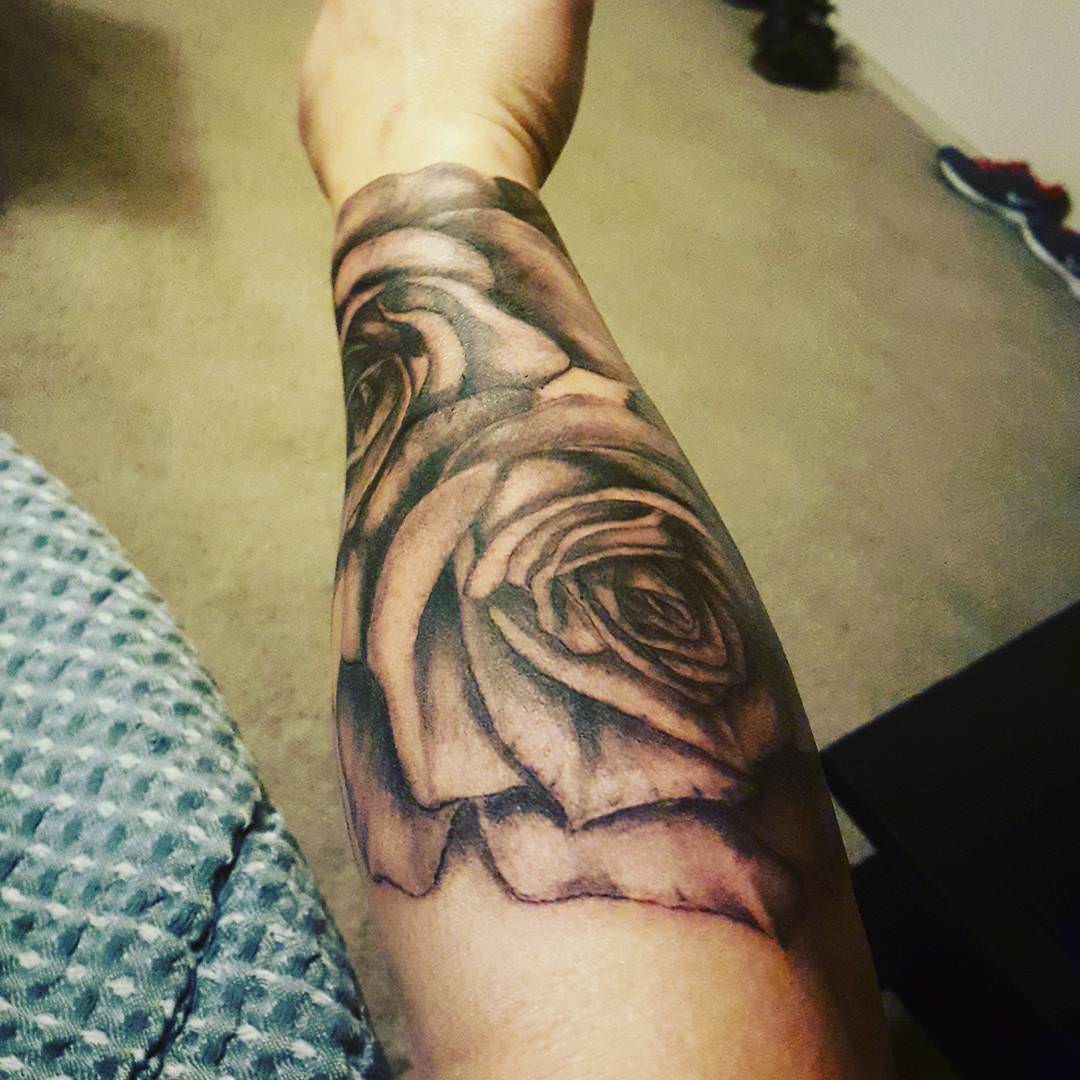 flower forearm sleeve tattoo