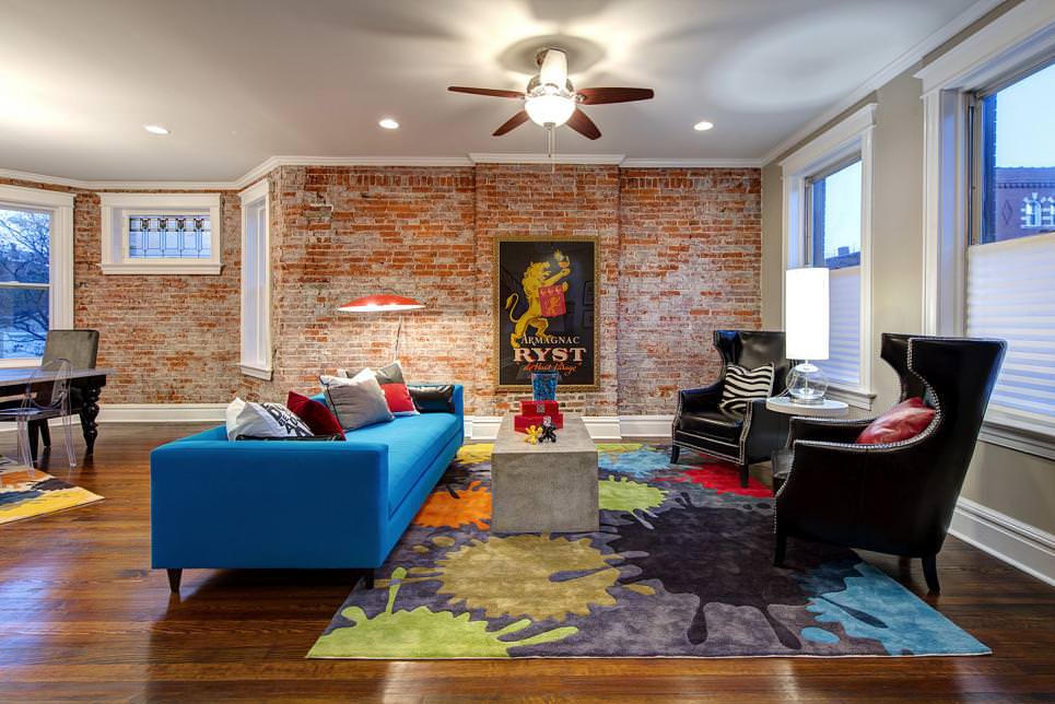 living room features brick accent wall