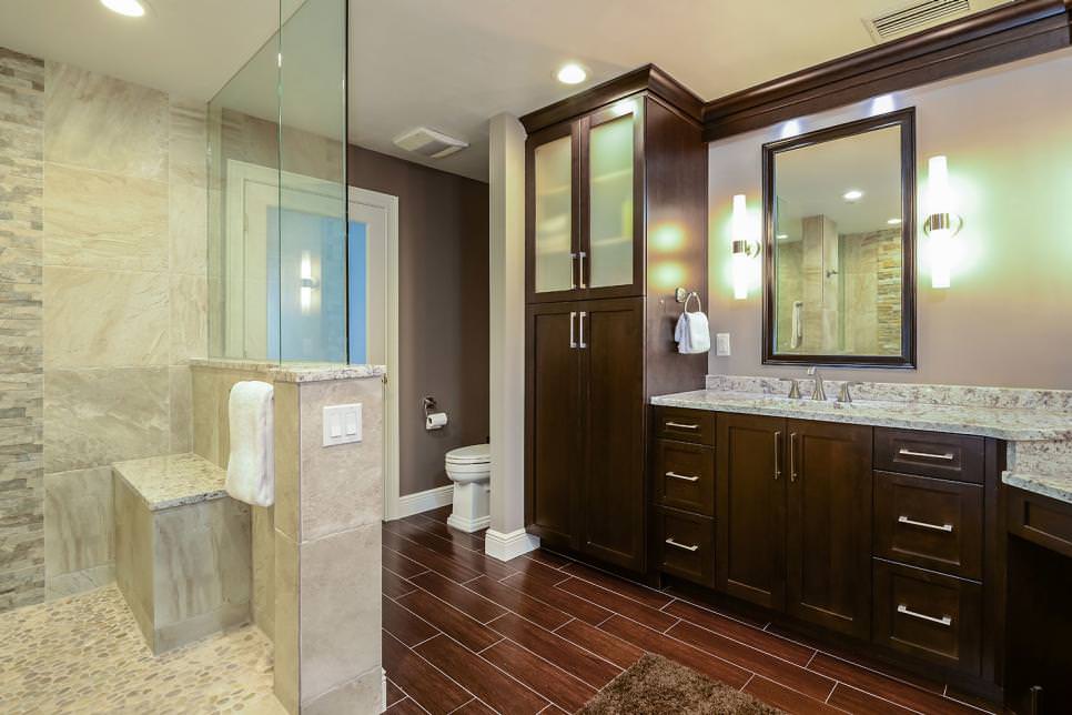 master bathroom with dark brown wooden cabinets