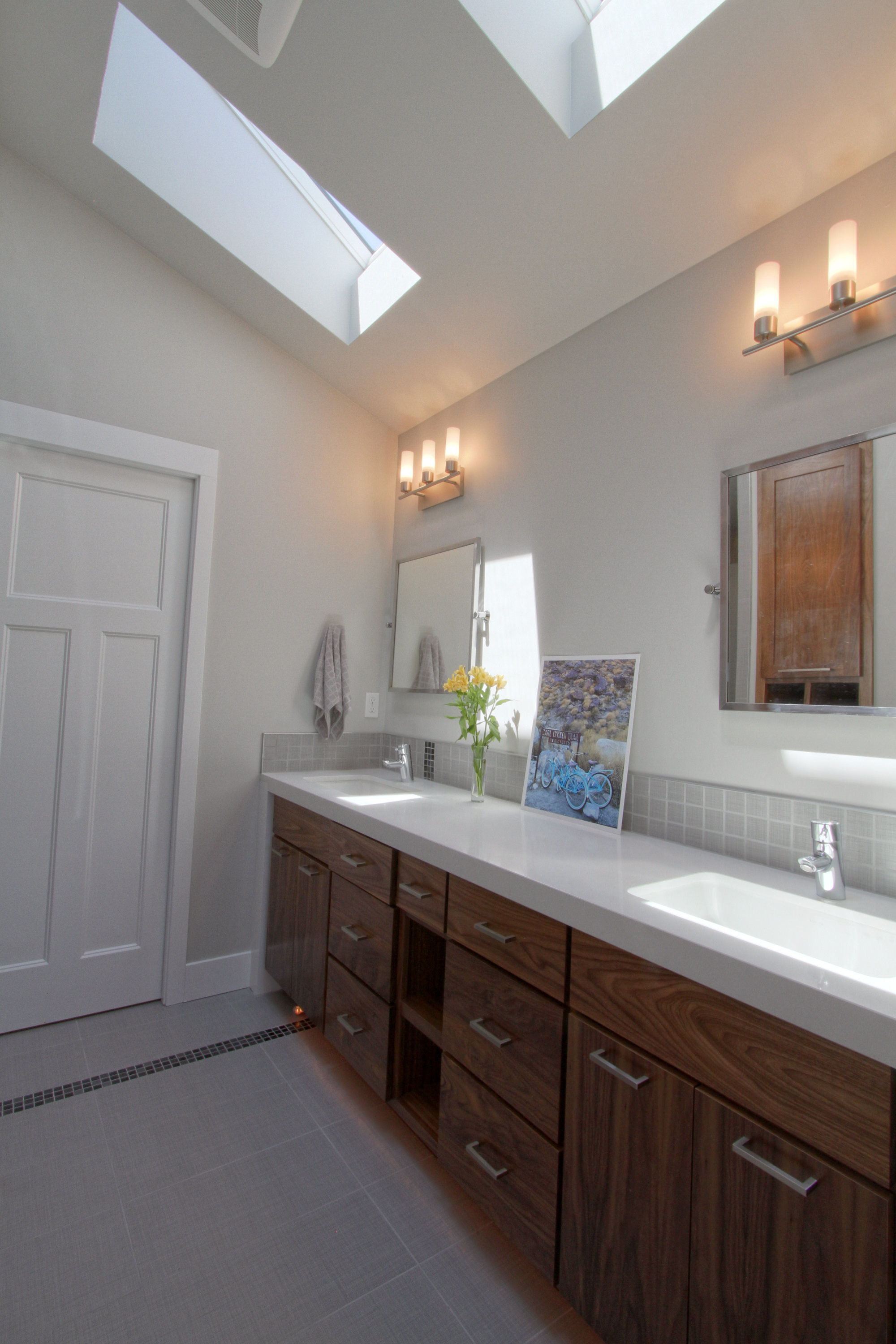 contemporary gray bathroom with natural wood vanity4