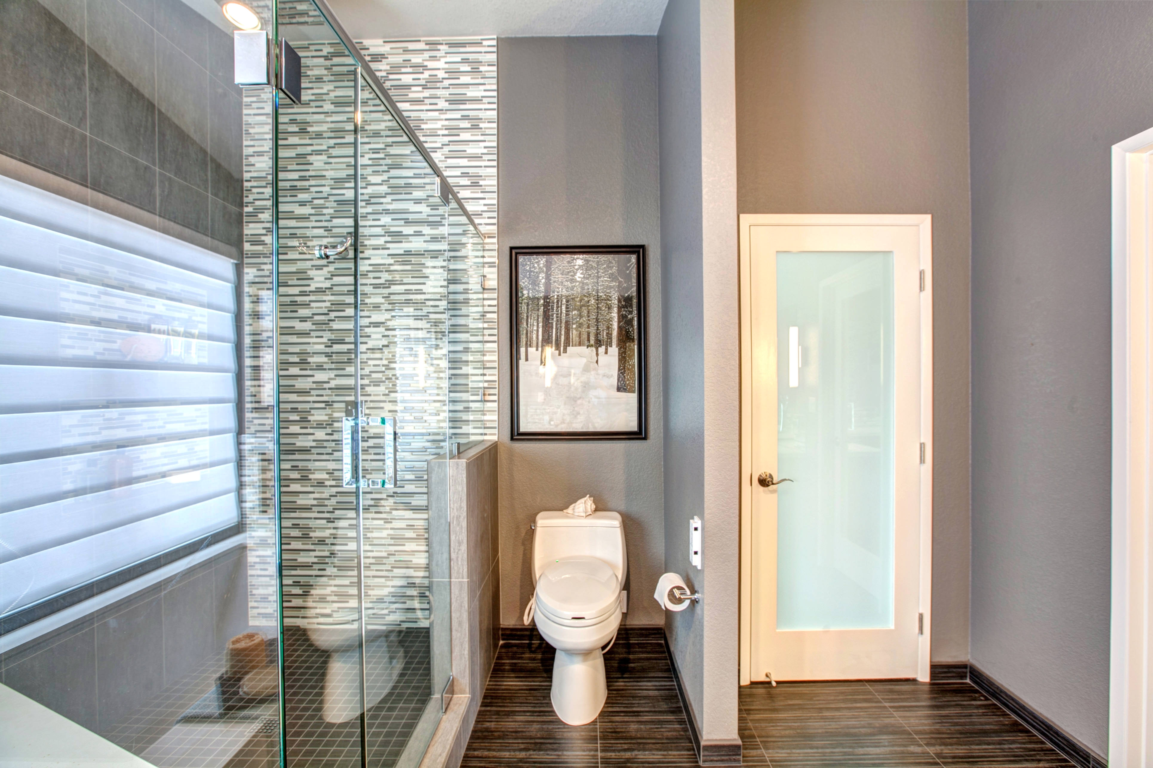 gray bathroom with walk in shower