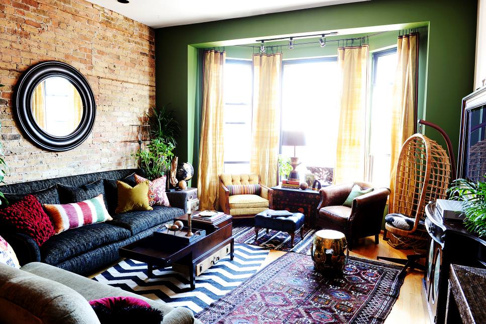 eclectic living room with green accent wall