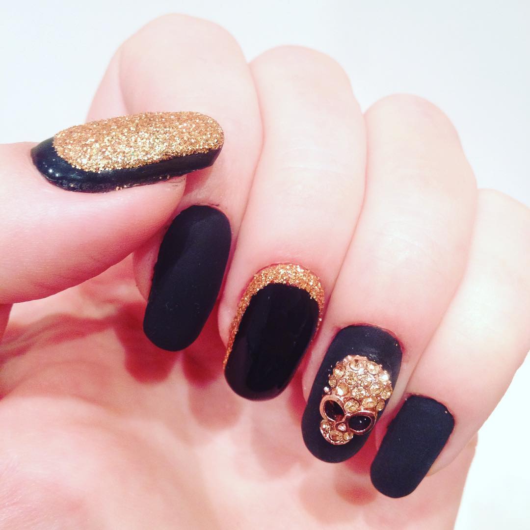 black skull glittering nail design