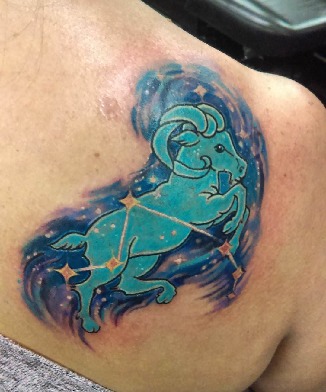 blue color aries tattoo