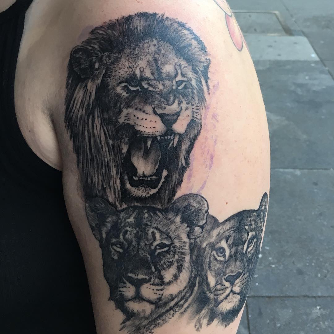 scare lions sleeve tattoo