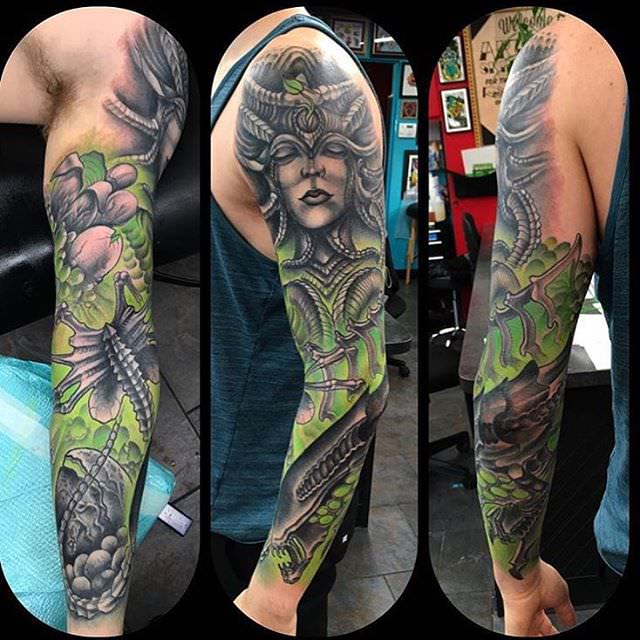 green and black sleeve tattoo