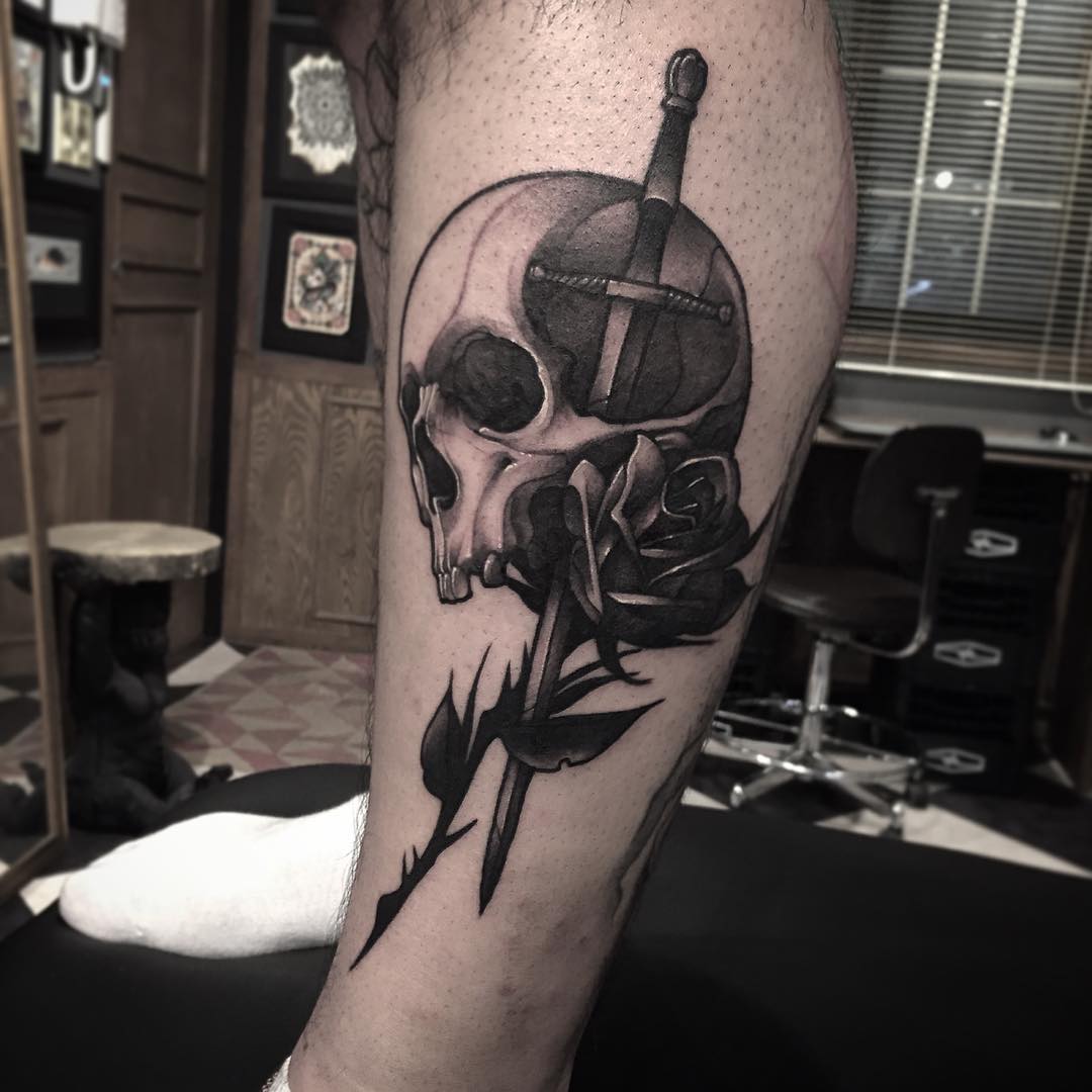 Skull and sword tattoo meaning