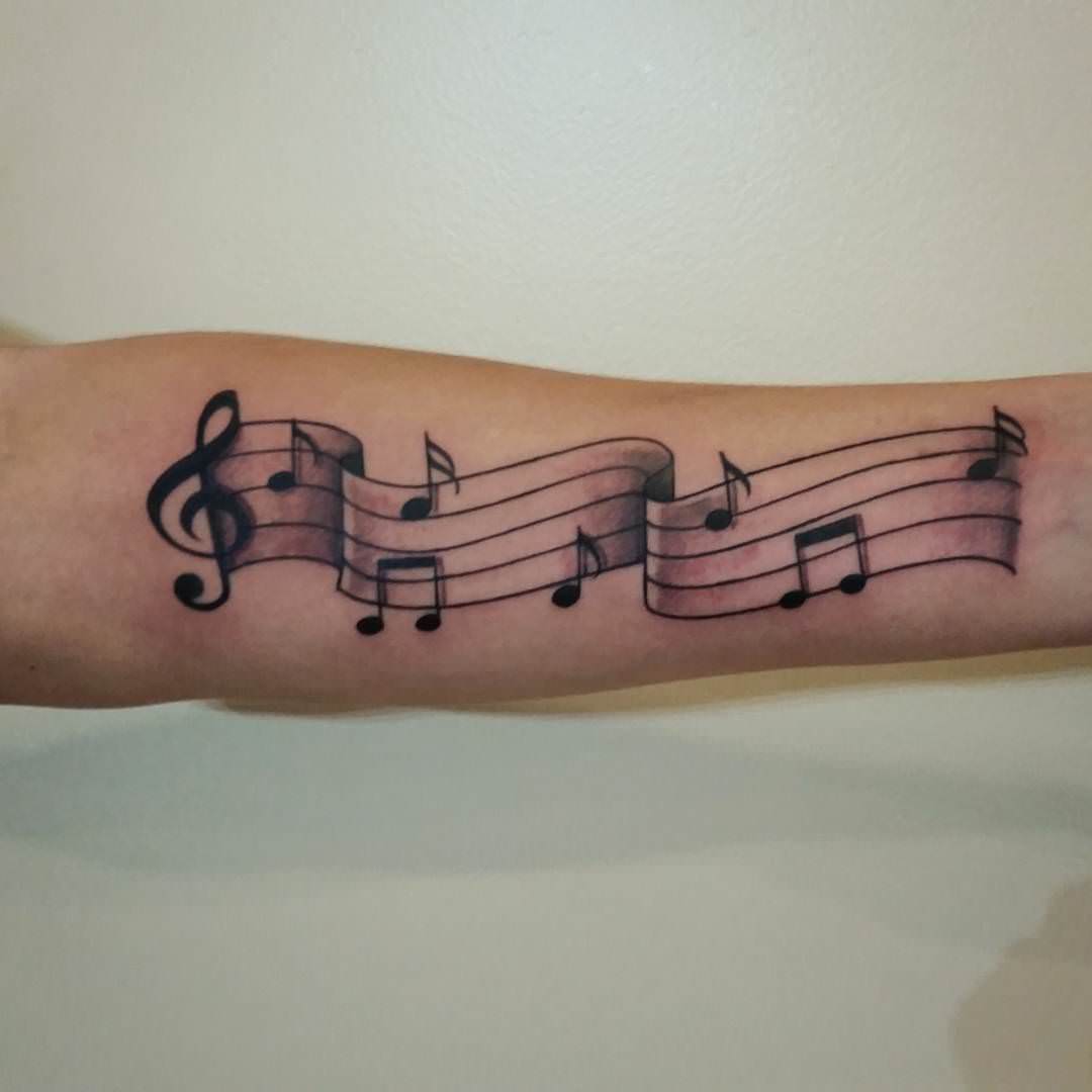 music note tattoo on hand