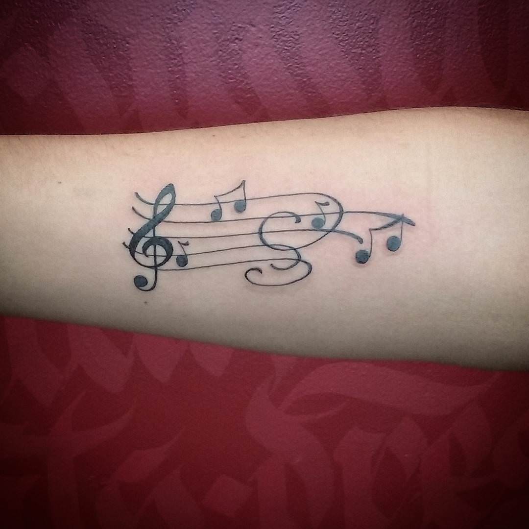music note designed tattoo