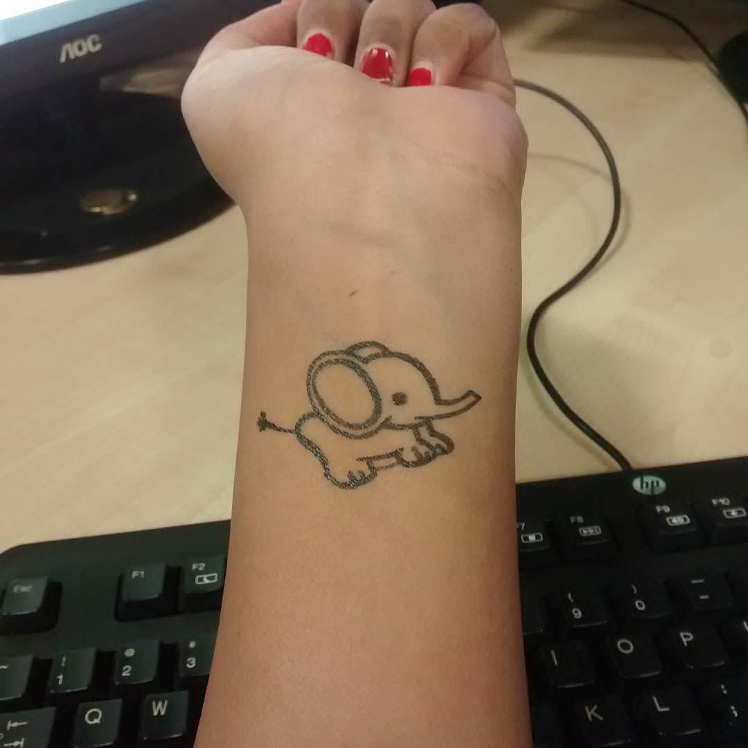 tiny elephant tattoo