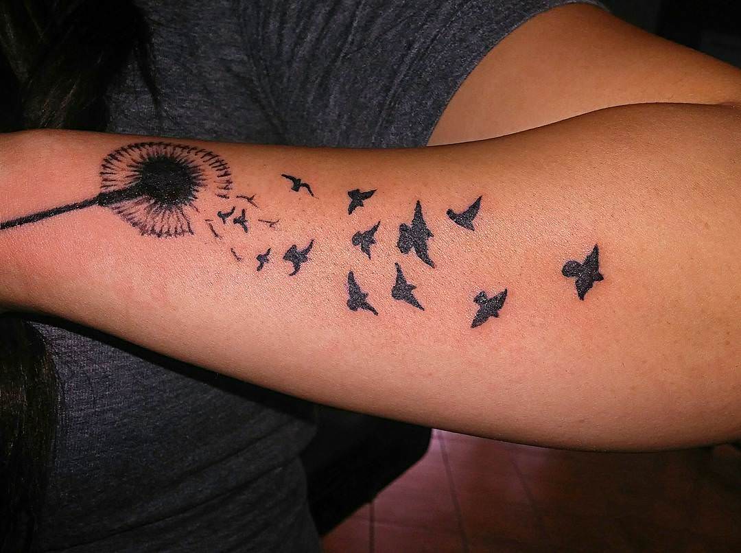 black dandelion tattoo