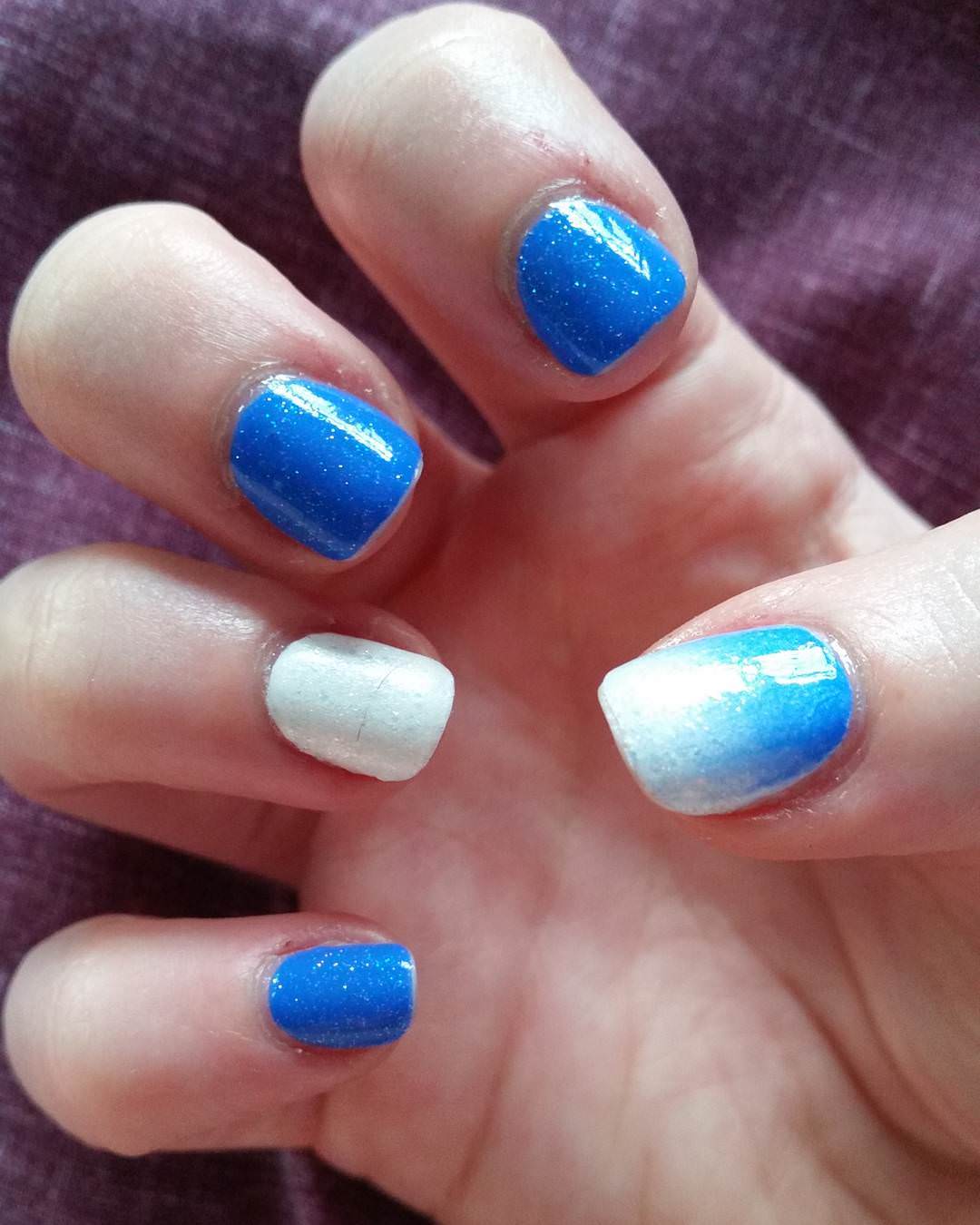 glittering blue and white nail design