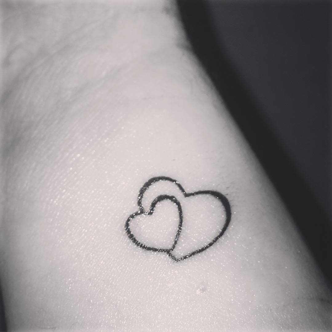 two hearts tattoo design