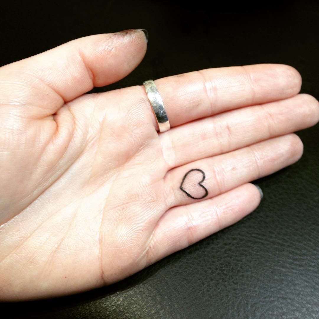heart shaped tattoo on finger