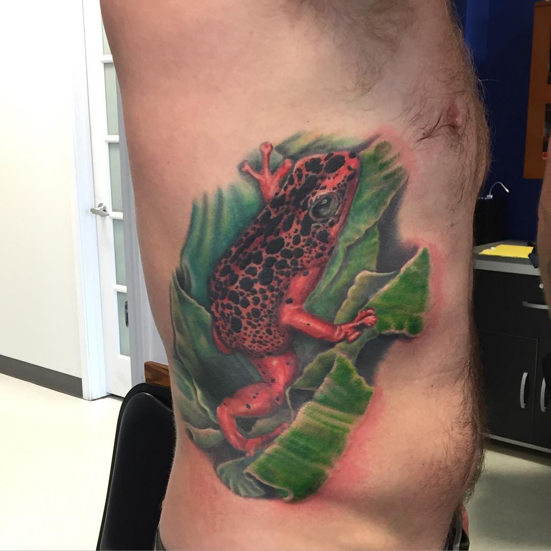 wonderful red frog tattoo