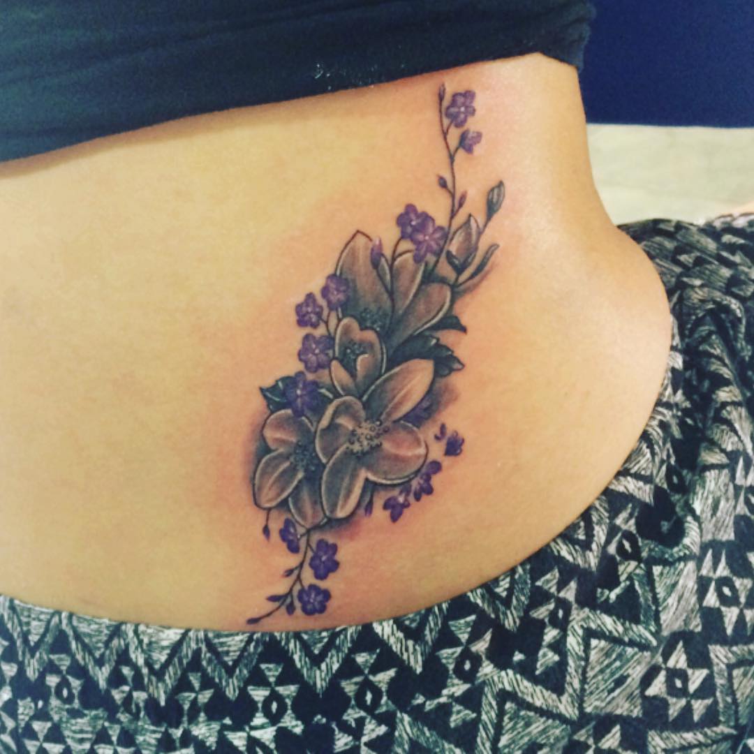 violet flower tatto on hip