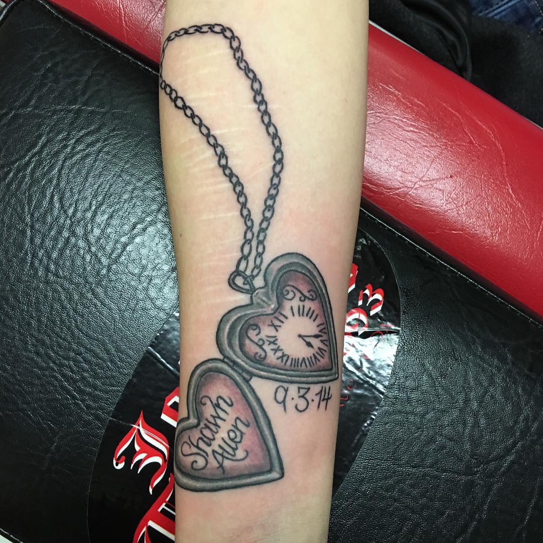 two heart shaped locket tattoo