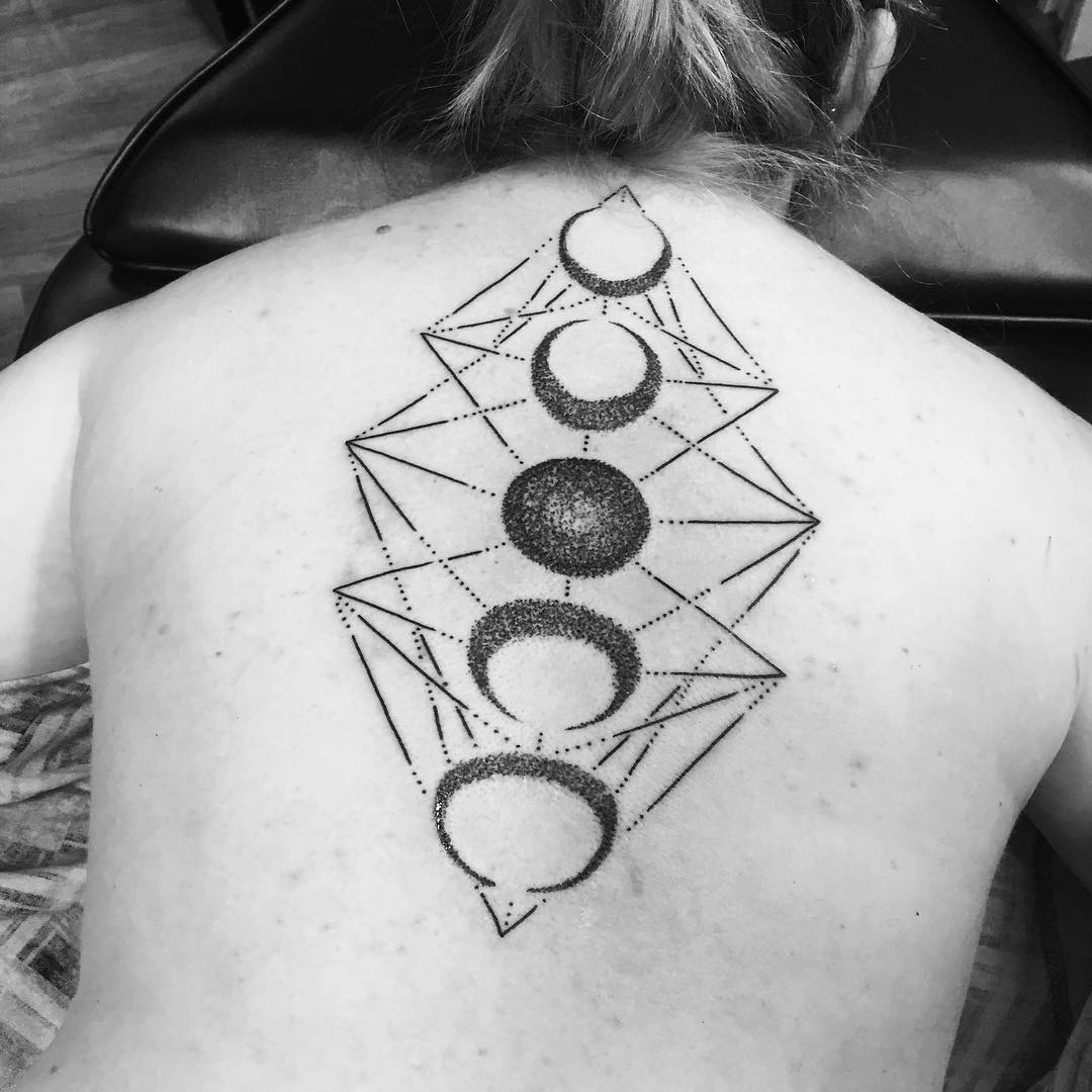moon phases spine tattoo