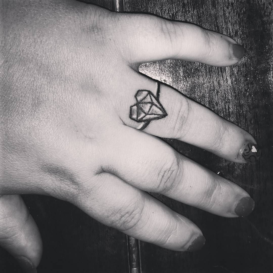 diamond tattoo on finger