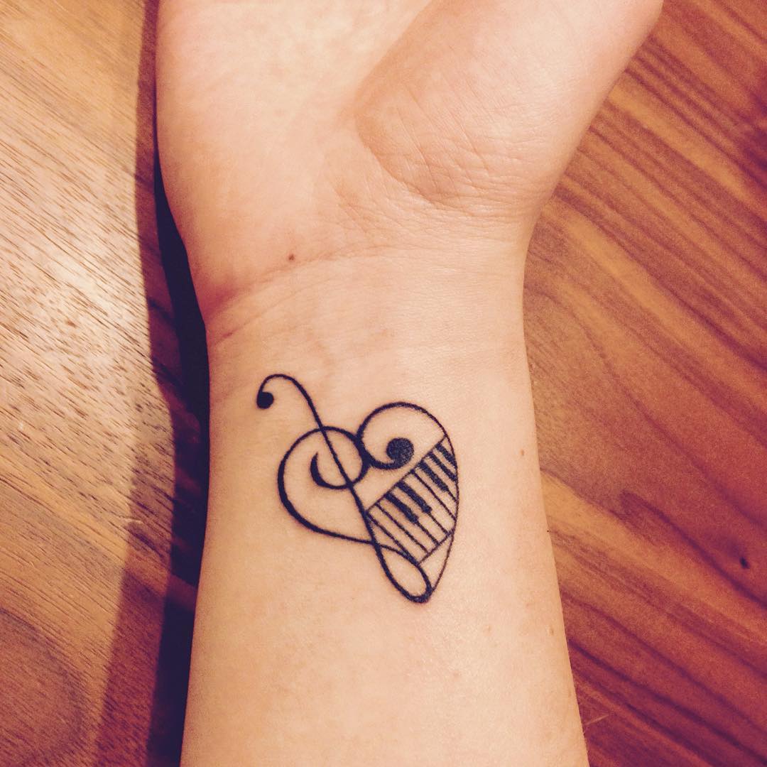 heart shaped piano music tattoo