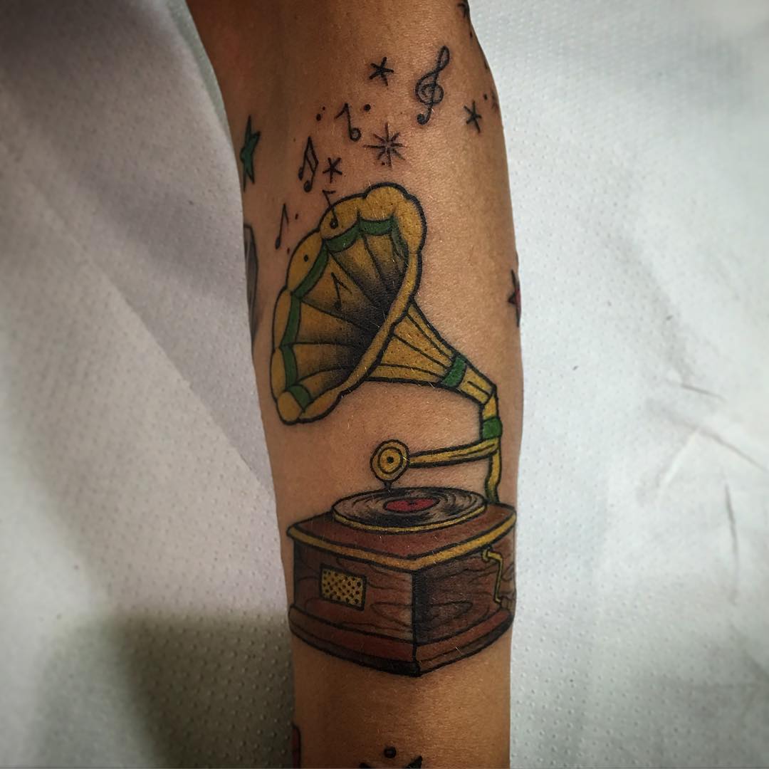 gramaphone with music notes tattoo