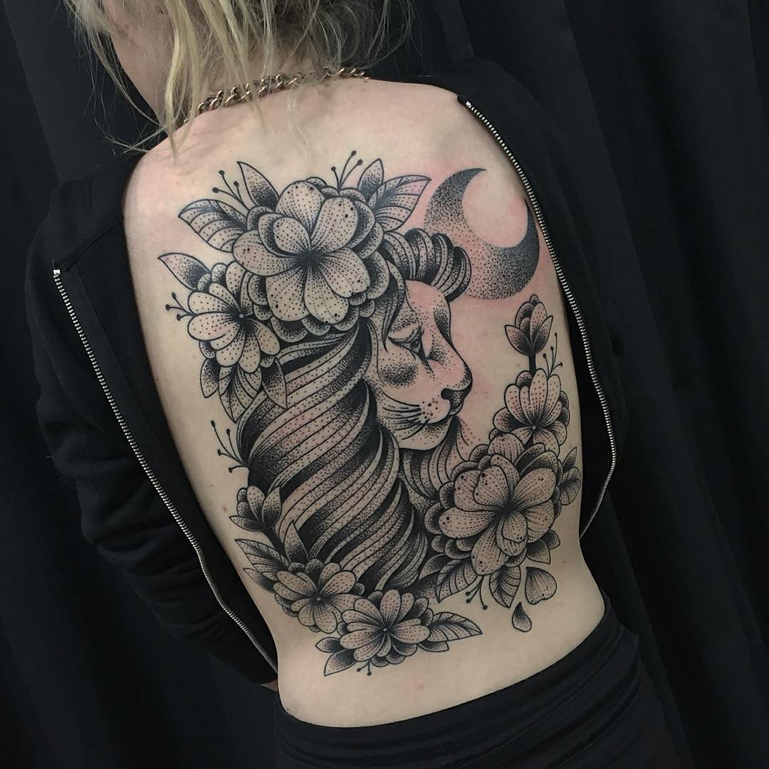 female lion tattoo with flowers
