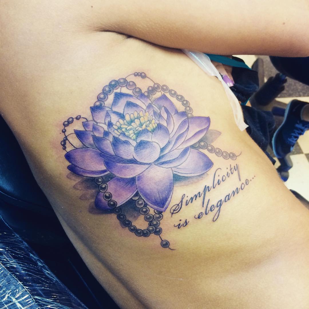tattoo of purple colored lotus