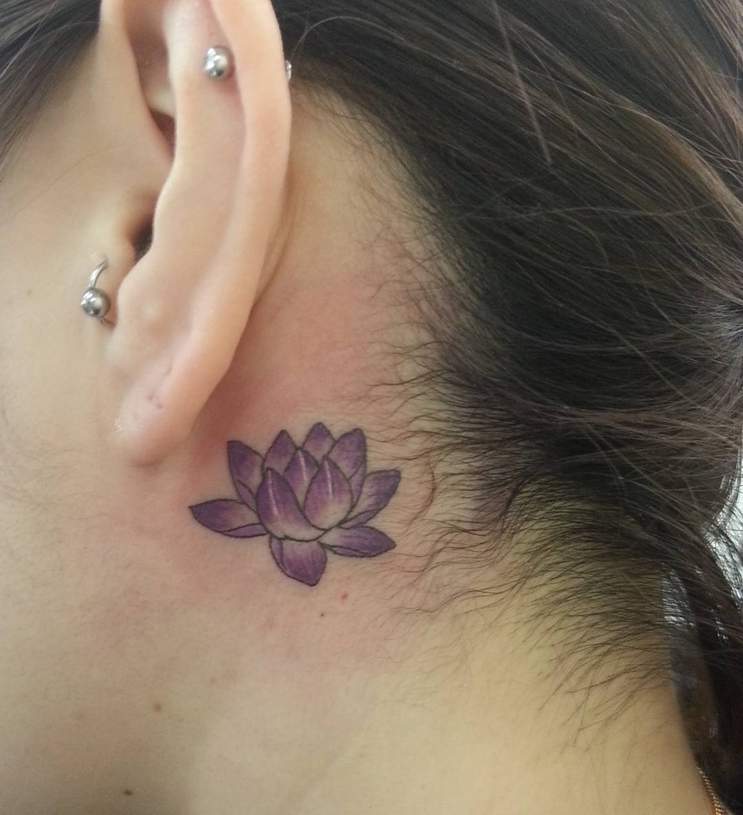 small lotus back ear tattoo design