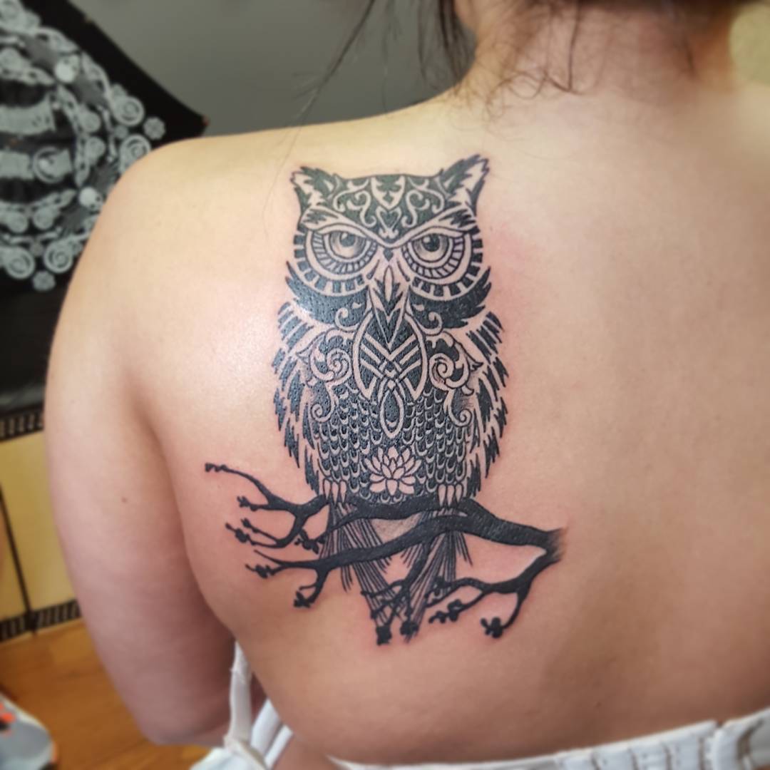 tribal owl back tattoo for girls