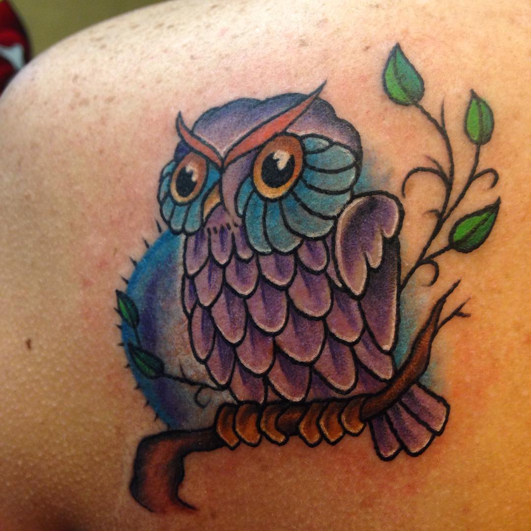 upper back owl on a anchor tattoo
