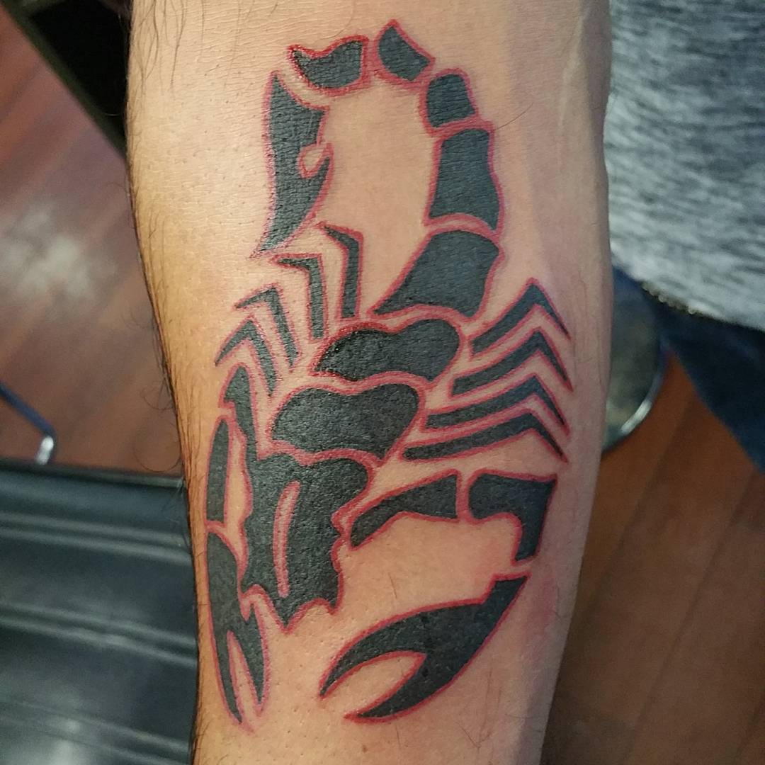 tribal black and red scorpion tattoo