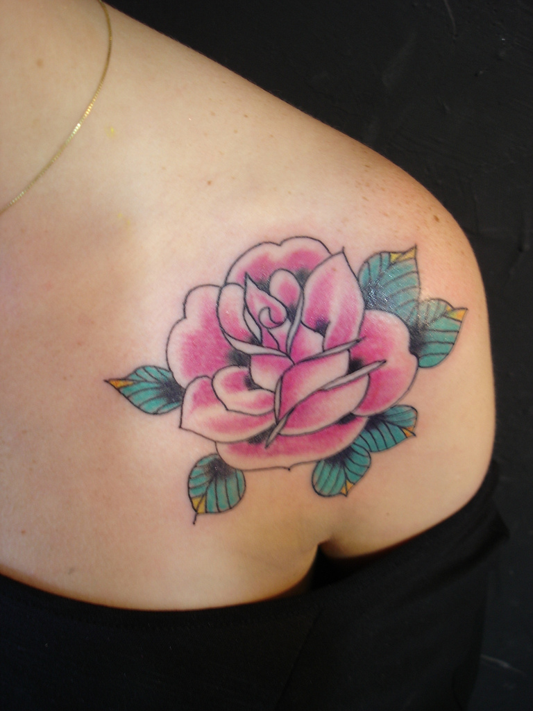 pink rose old school tattoo on shoulder