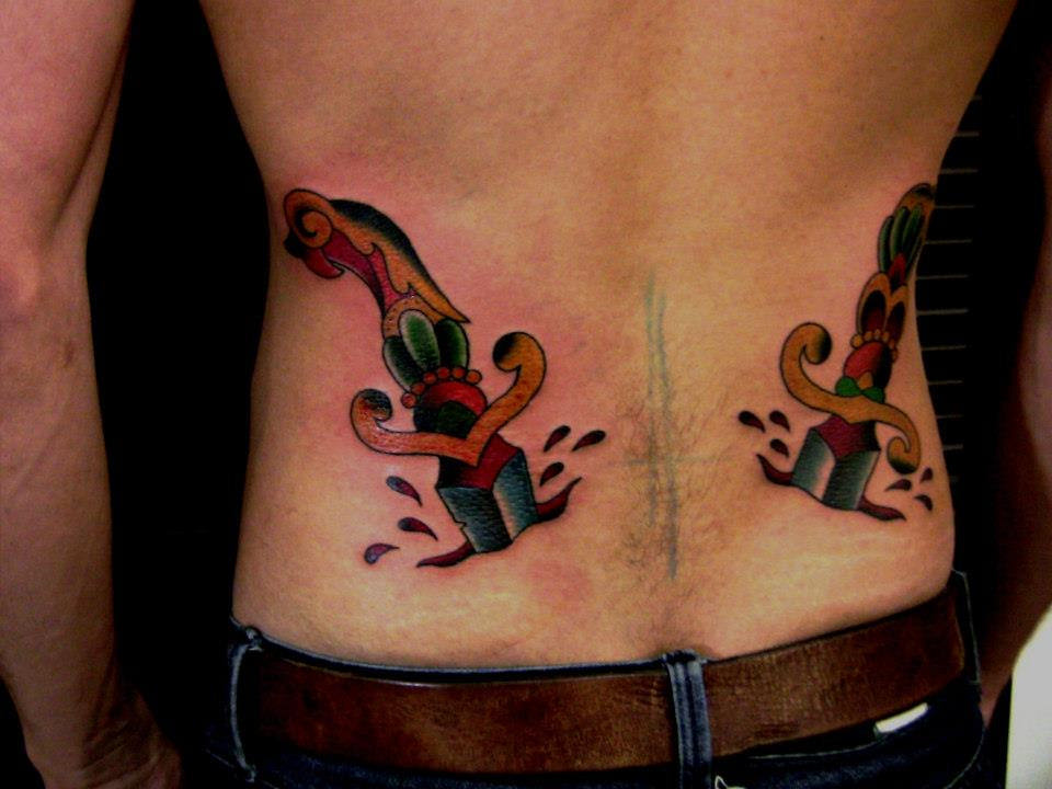 old school knifes tattoos on both side ribs
