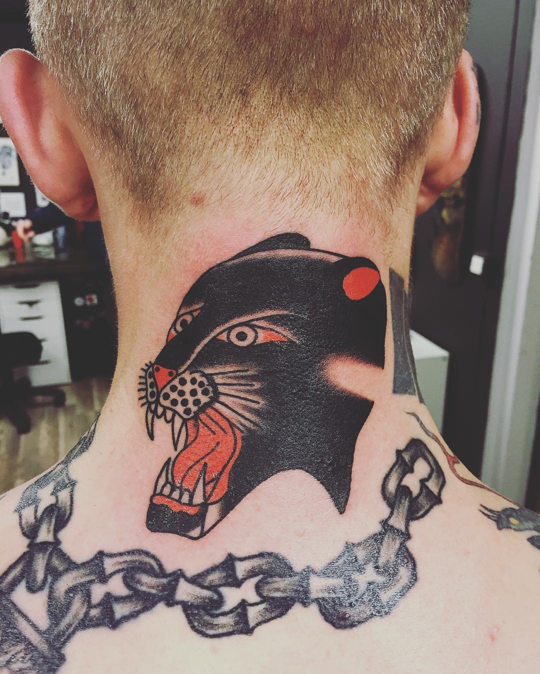 traditional panther tattoo on back neck