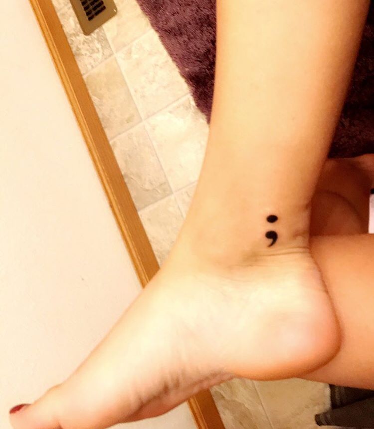 ankle sign tattoo