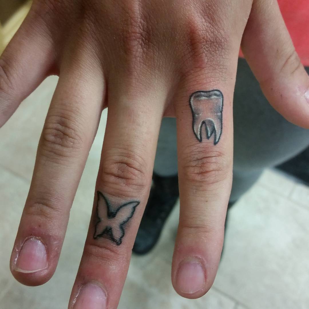 butterfly tattoo on finger