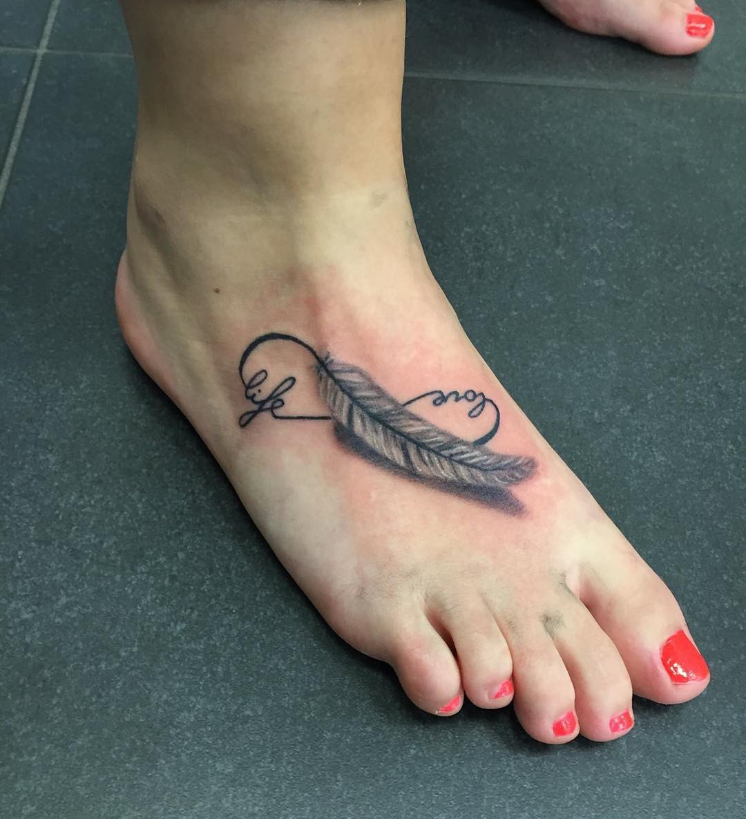 feather infinity tattoo on foot