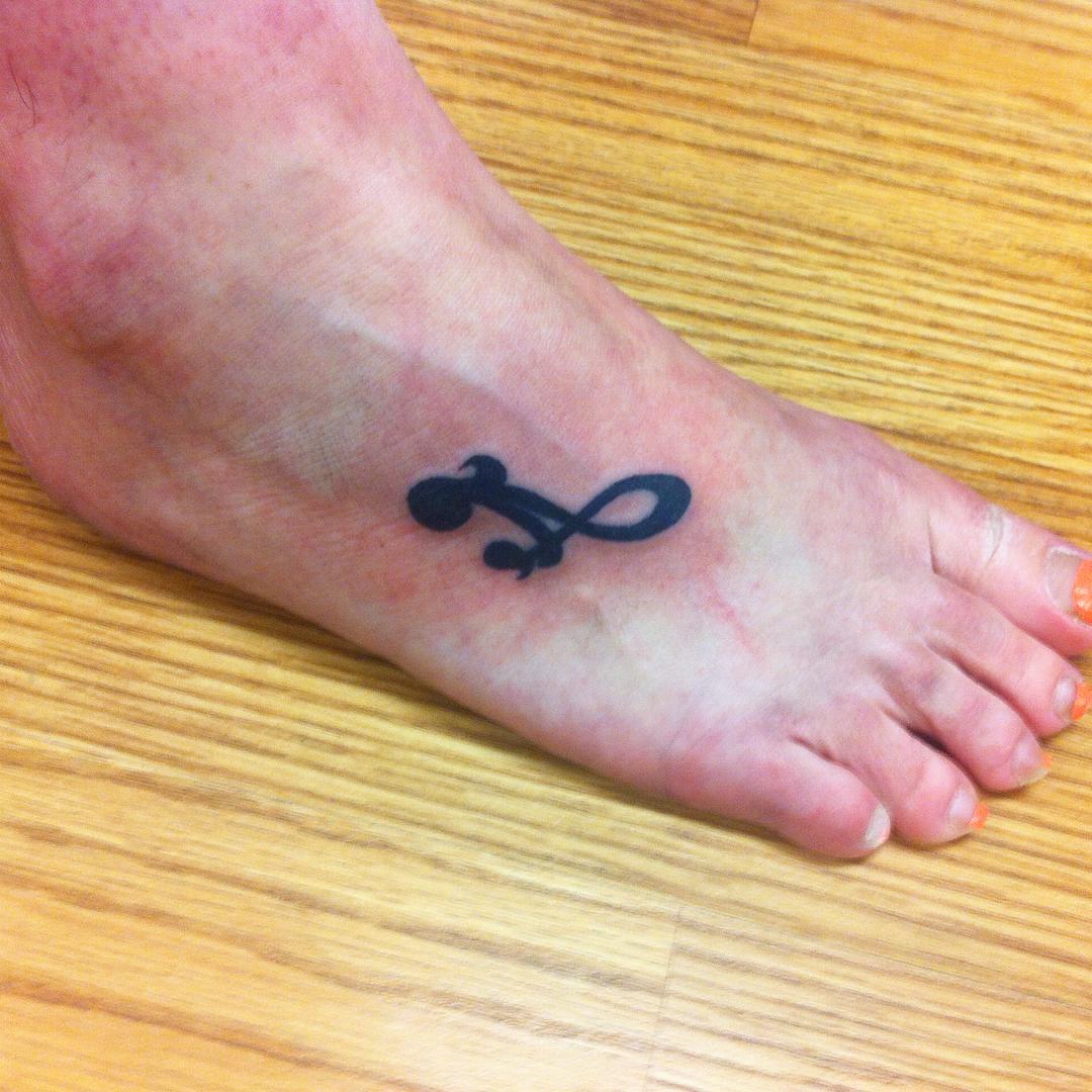 trendy mother daughter tattoo on foot