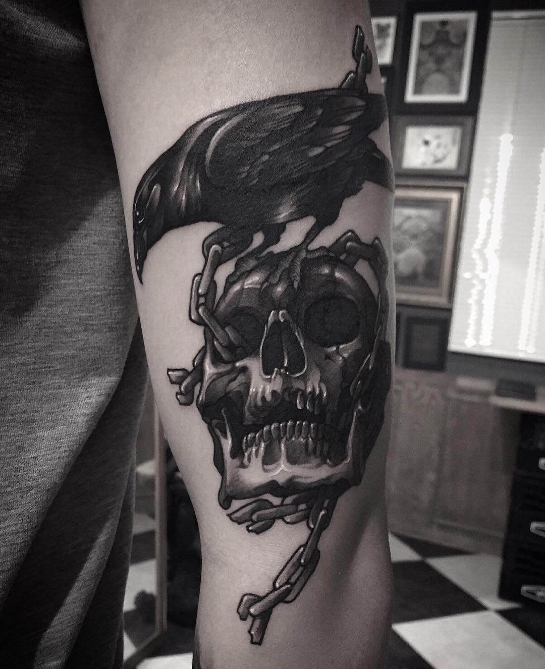 crow tattoo with skull