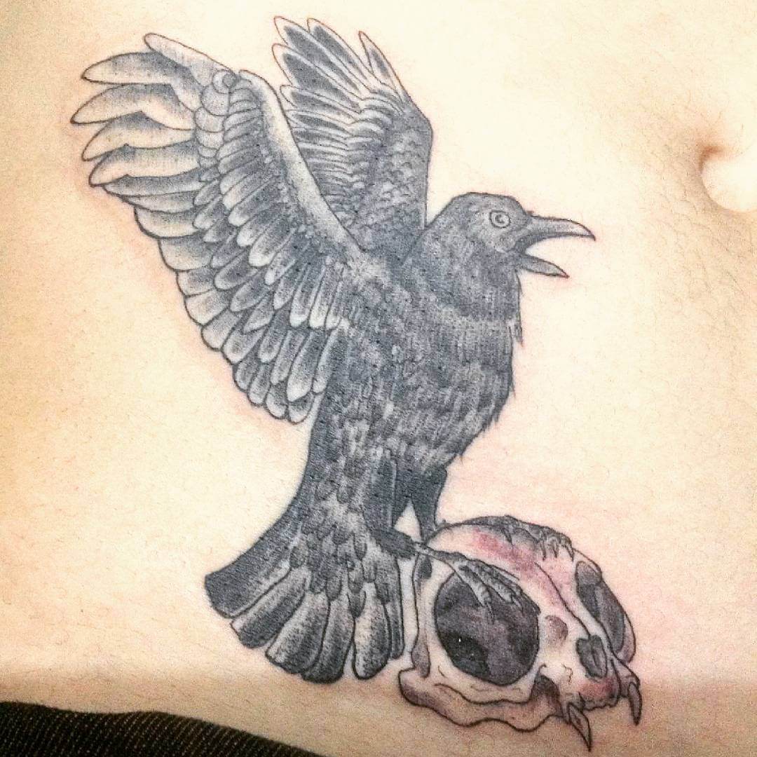 crow tattoo design on stomach