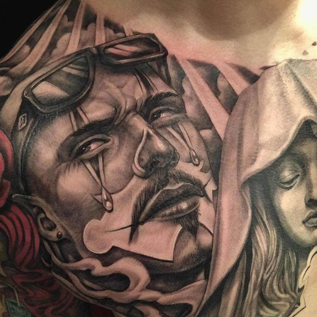 men and women clown tattoo on chest