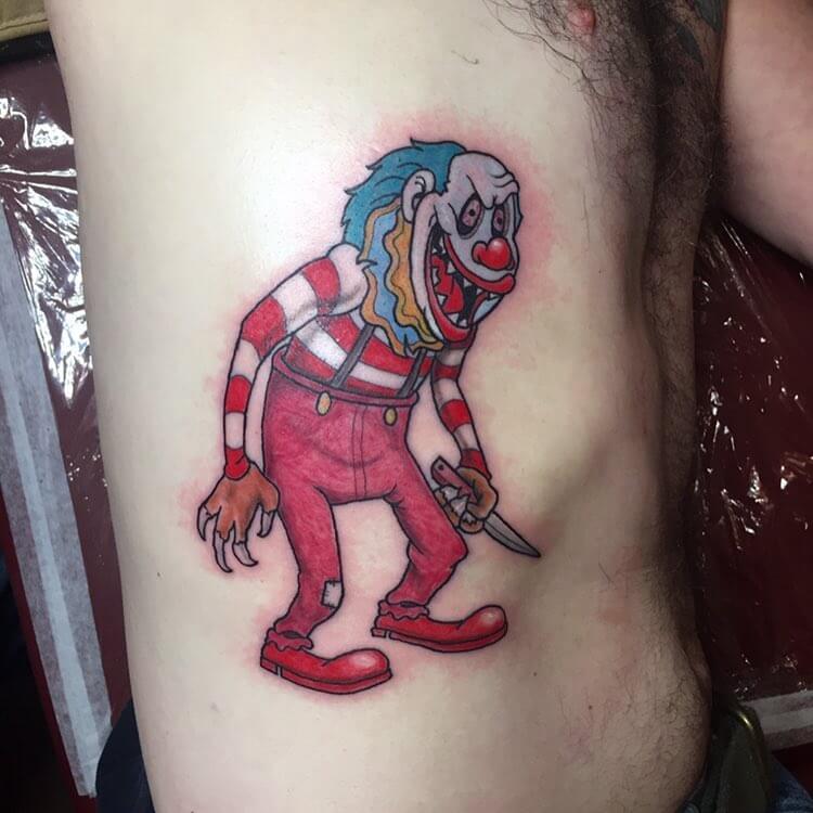 clown tattoo on the ribs for men