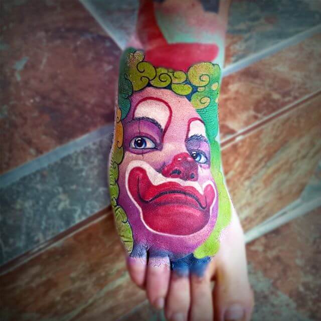 joker clown tattoo on foot
