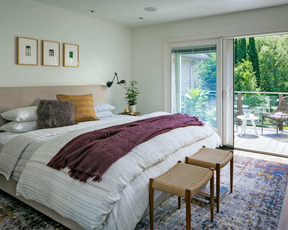 eclectic master bedroom with deck