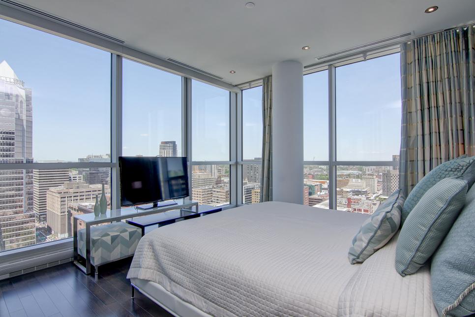 beautiful contemporary bedroom with panoramic views
